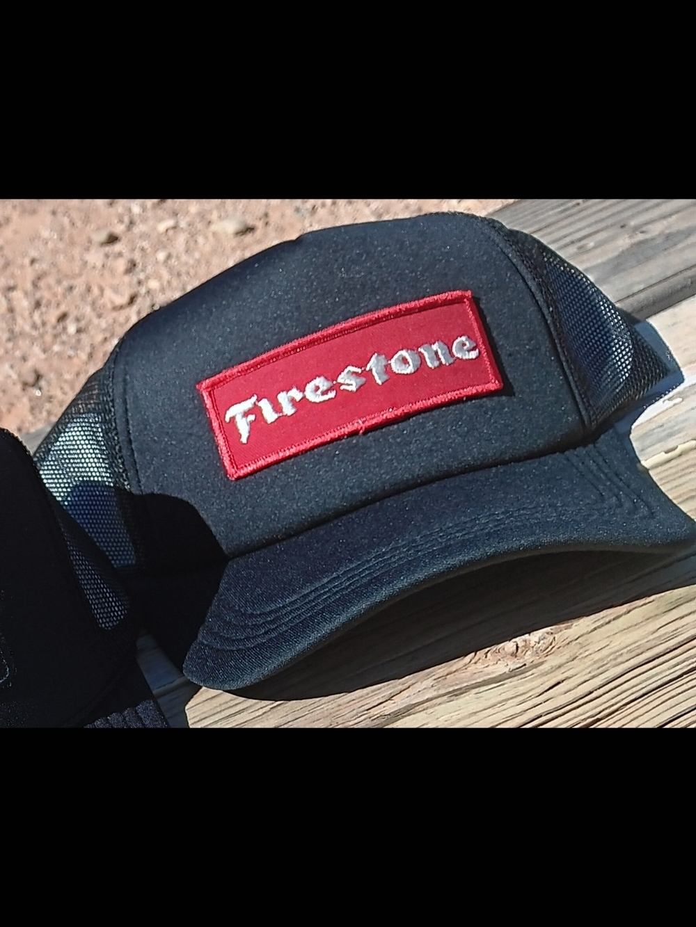 Firestone Black Trucker Hat with Red Patch